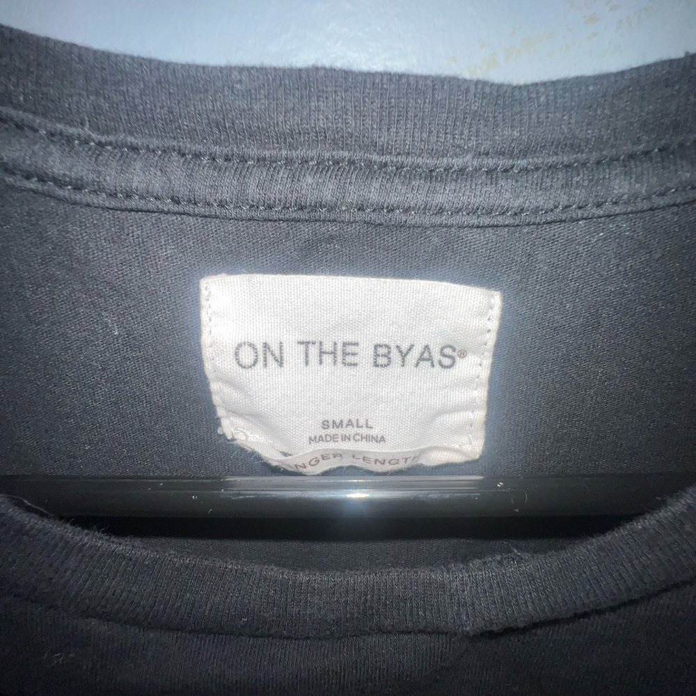 On the Byas Small Longer Length Black Tee